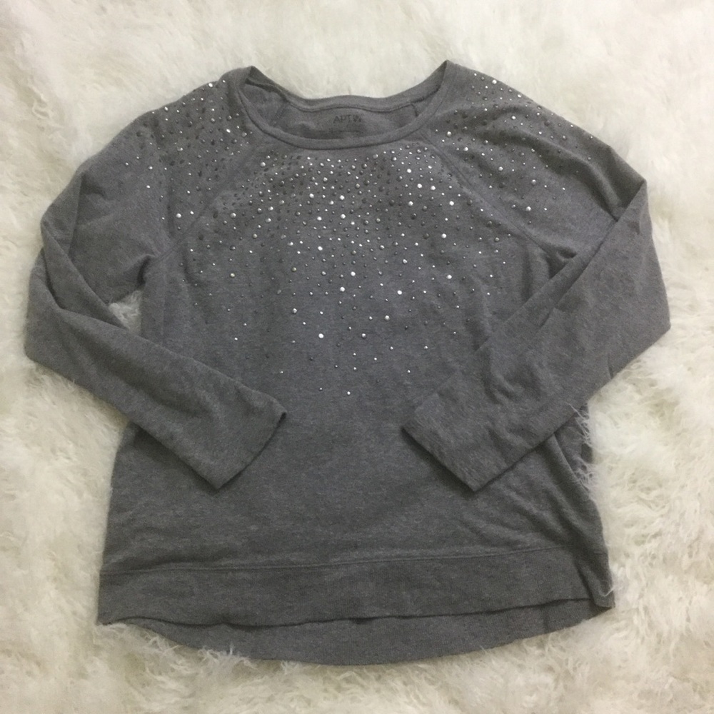 Gray sweater with metal appliqués
